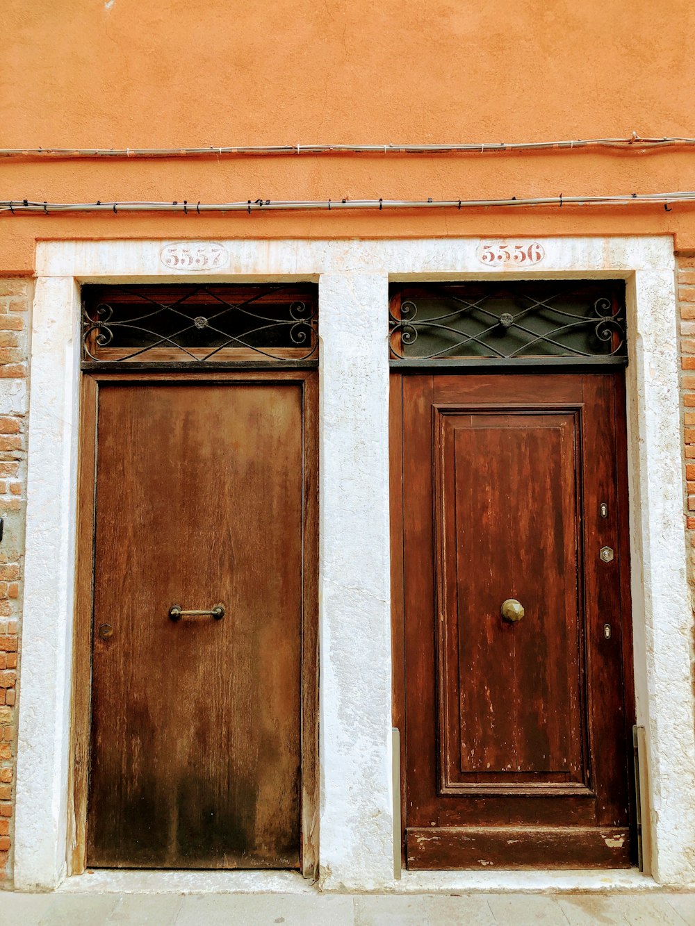 two closed brown wooden doors