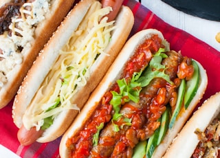 four assorted-type hotdog sandwiches