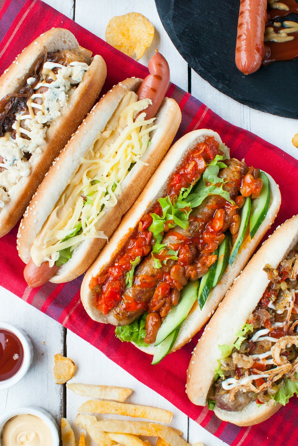 four assorted-type hotdog sandwiches