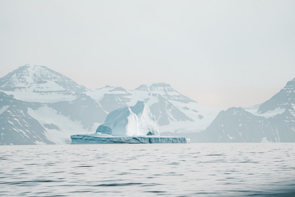 iceberg near mountain