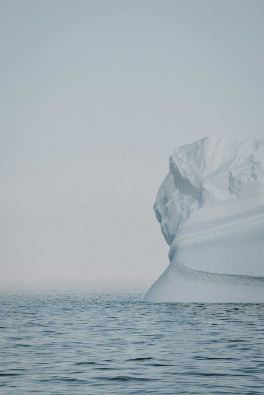 selective focus photo of iceberg on large body of water at winter