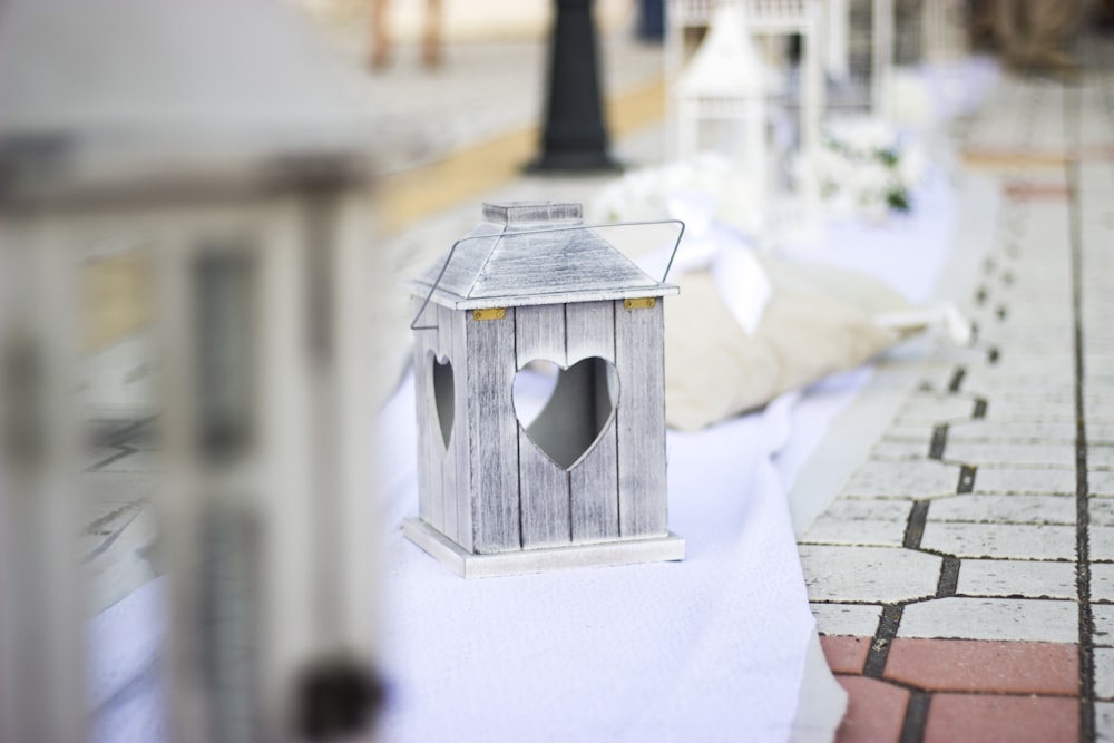 selective focus photograph of gray candle lantern