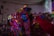 A vibrant dance performance on stage with dancers in dynamic poses and colorful costumes.