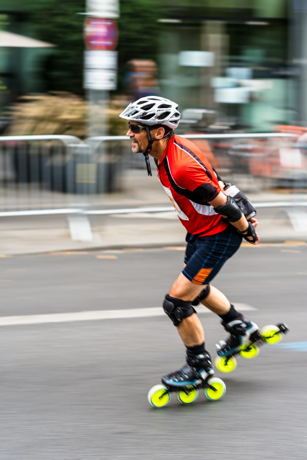 man in road skating during daytime