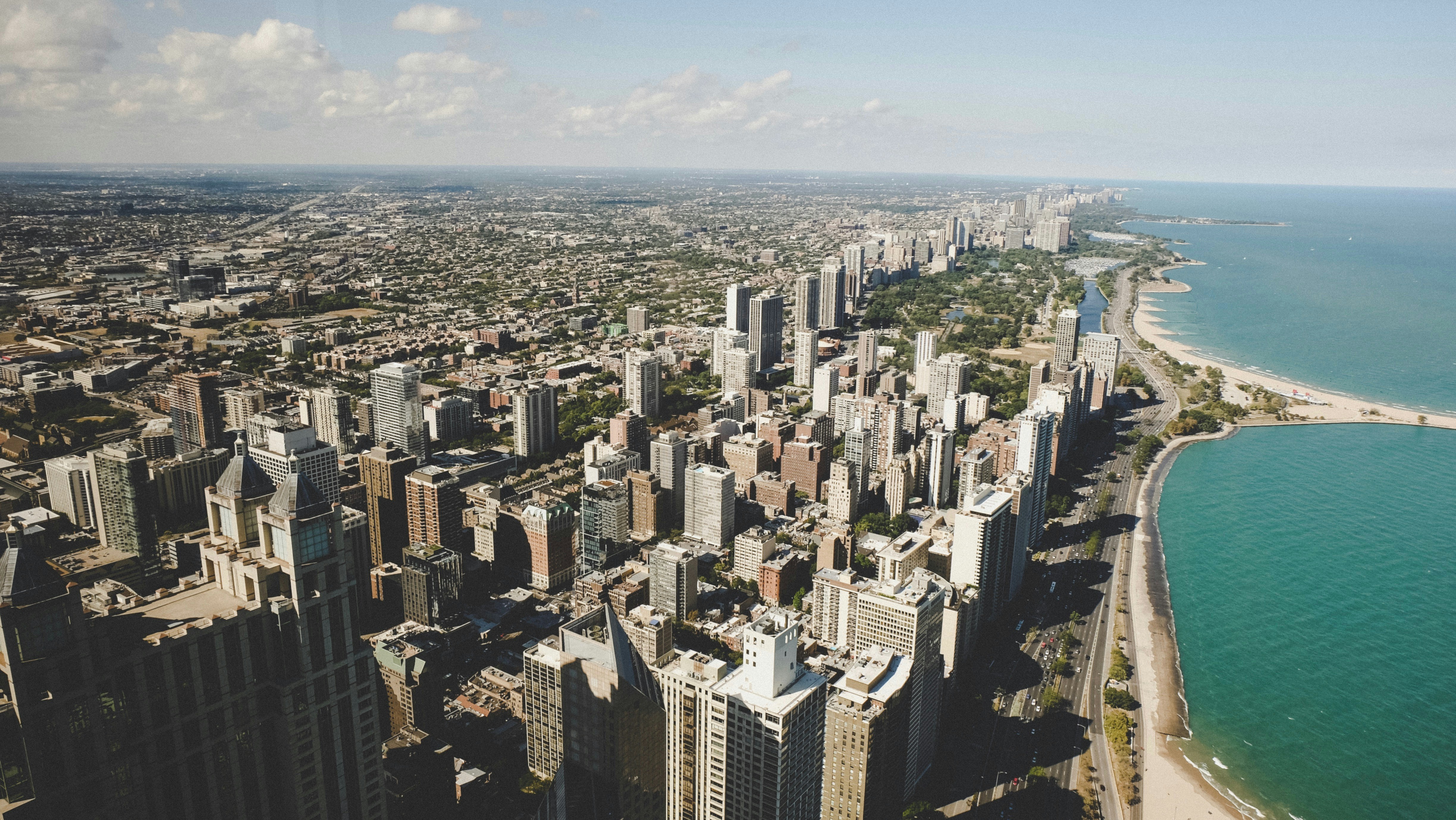 Stunning view of Lake Michigan and the Chicago shoreline from a luxury high-rise window - uptown chicago luxury residences