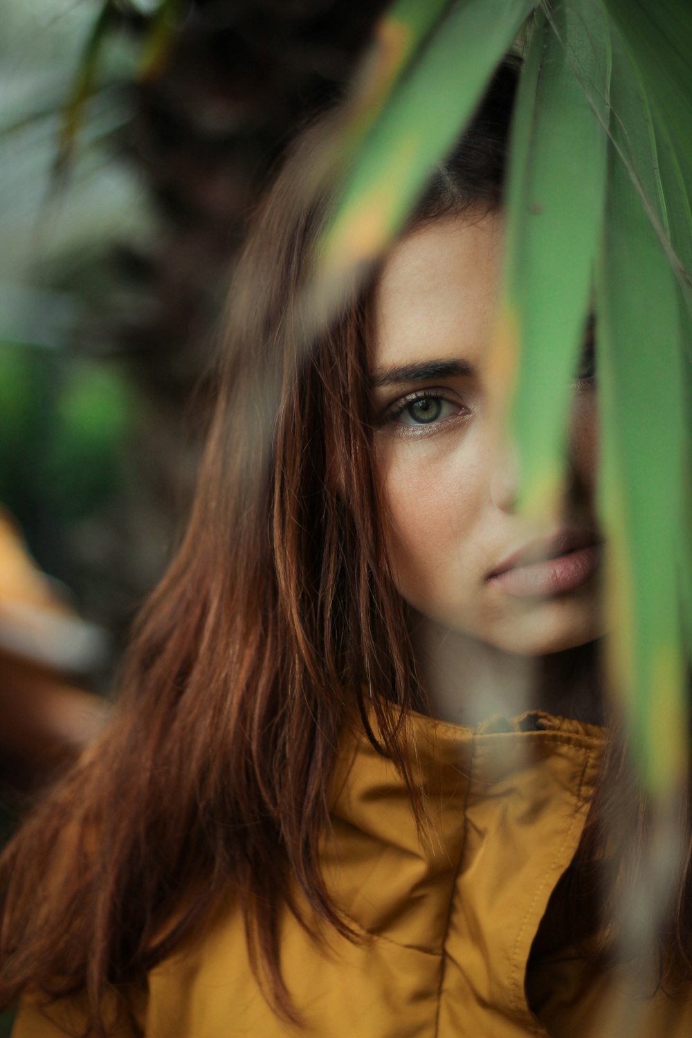 woman standing at back of leaf