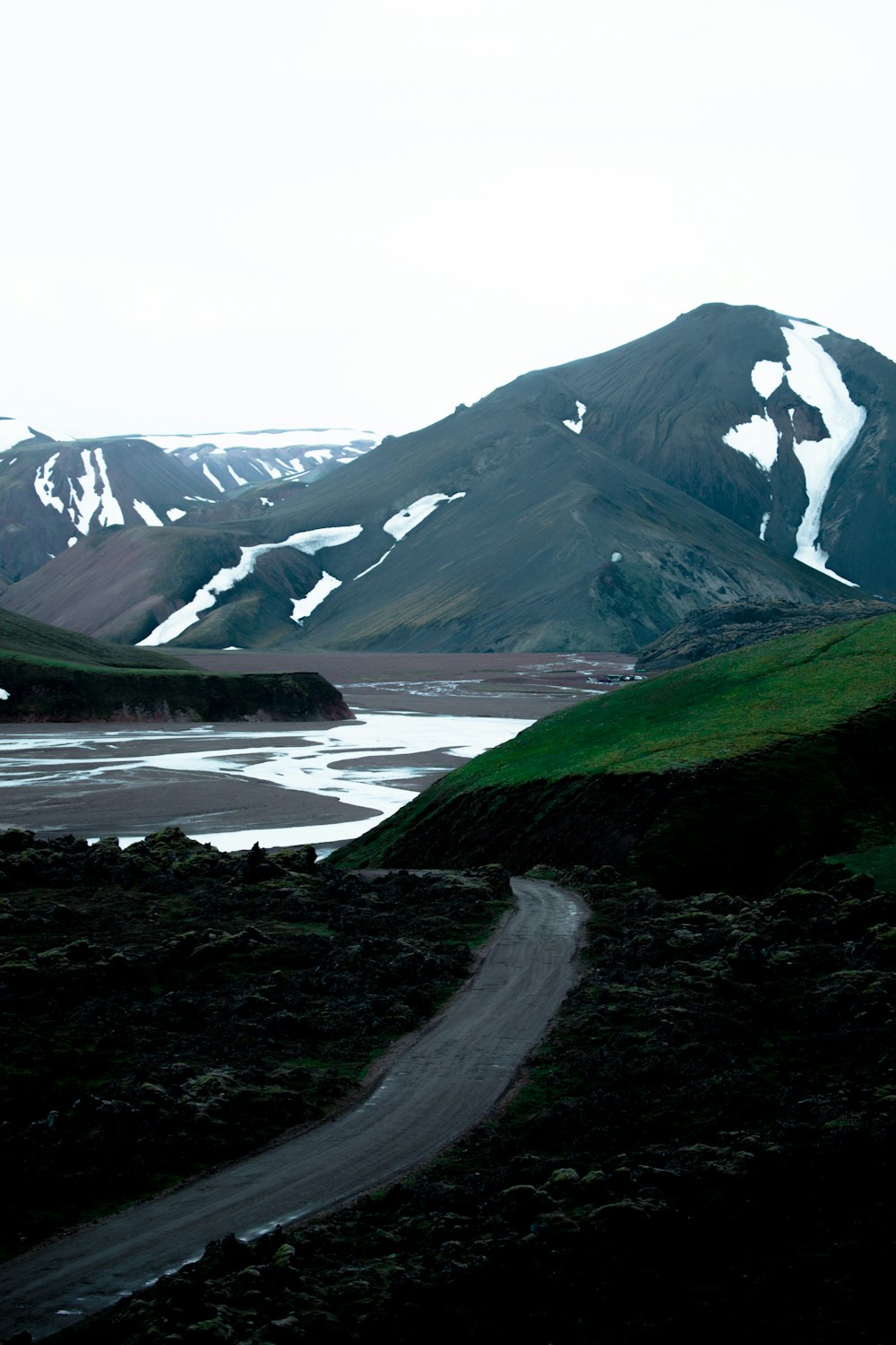 road near across mountian during daytime