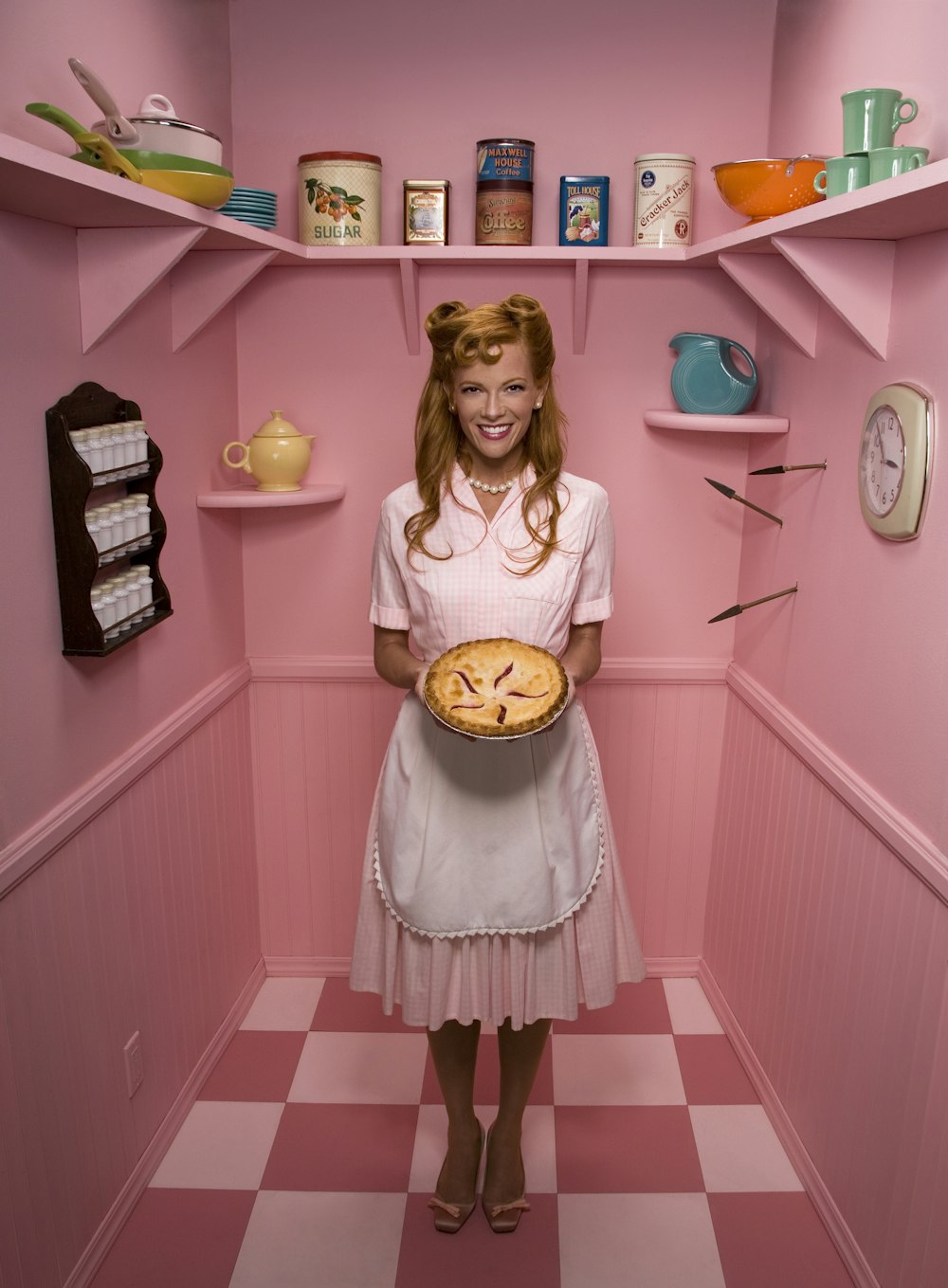 woman holding pie in storage room