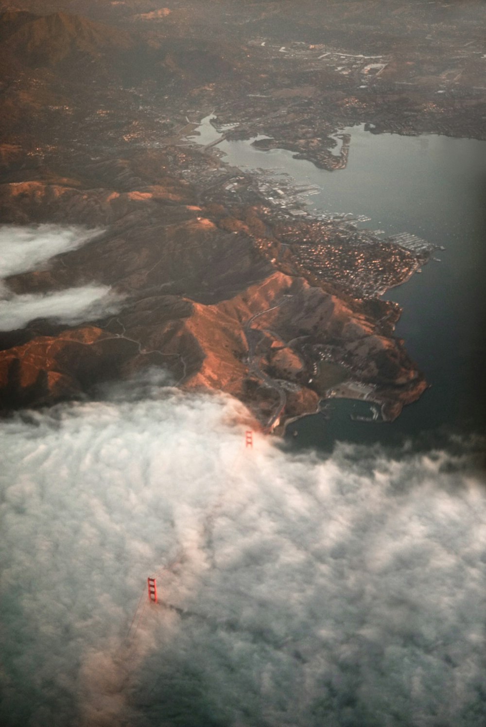 top view of mountain surrounded by body of water