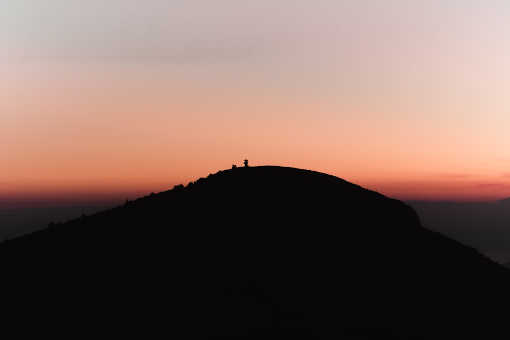 silhouette of mountain at golden hour