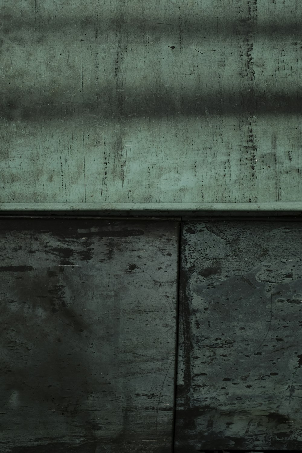 a black and white photo of a clock on a wall