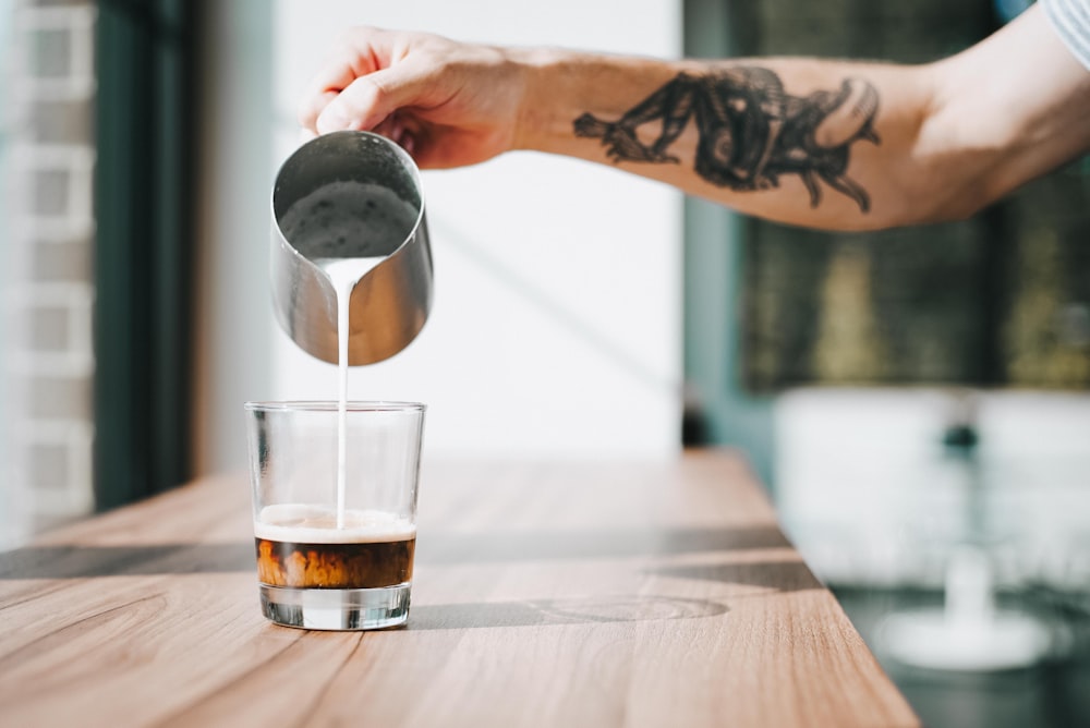 clear drinking glass on brown surface