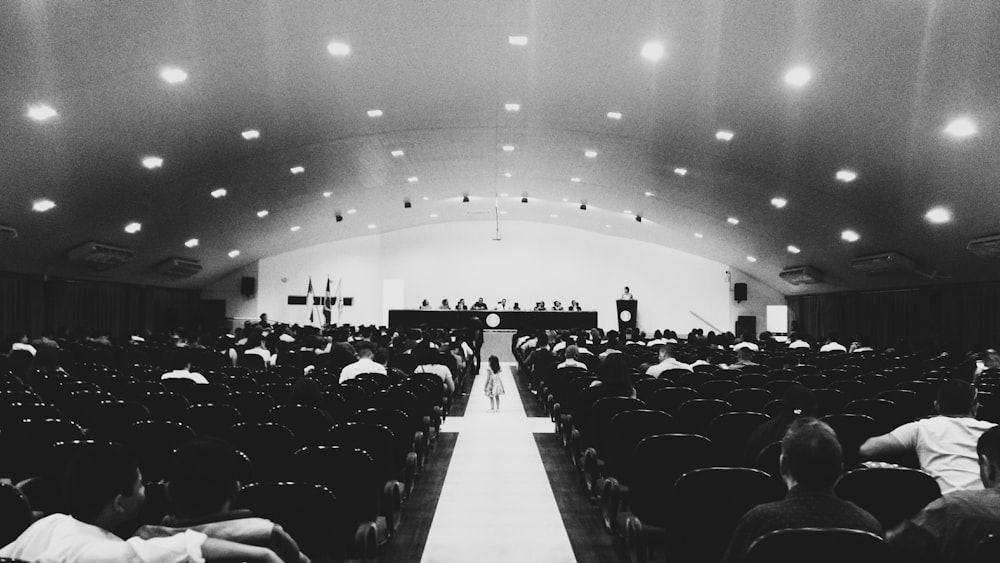 grayscale photography of auditorium