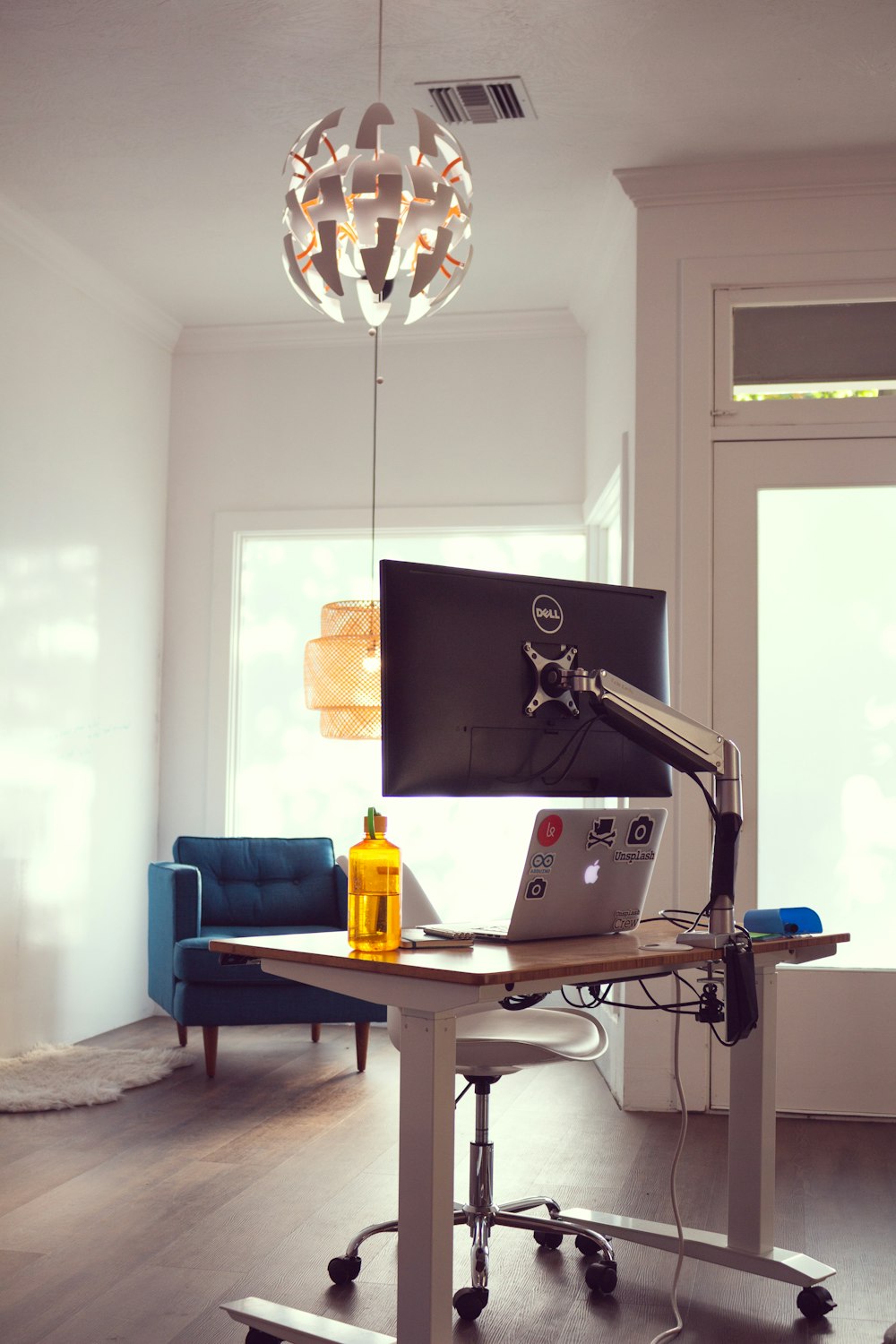 black flat screen computer monitor in brown wooden computer table