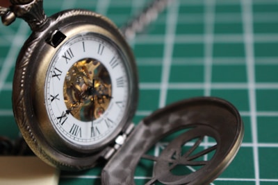 Close-up of a vintage watch being carefully examined for appraisal.