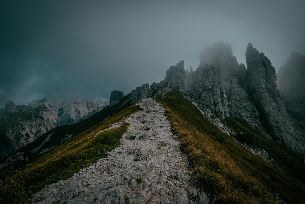 mountain peak trail surrounded with fogs