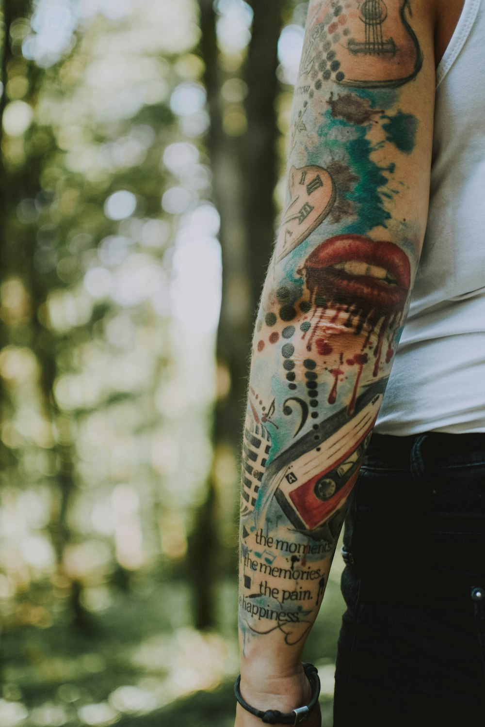 person with musical-themed tattoo on arm