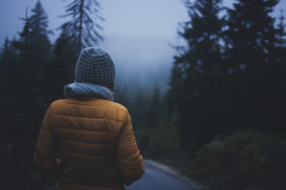 selective focus photography of person wearing gray knit cap