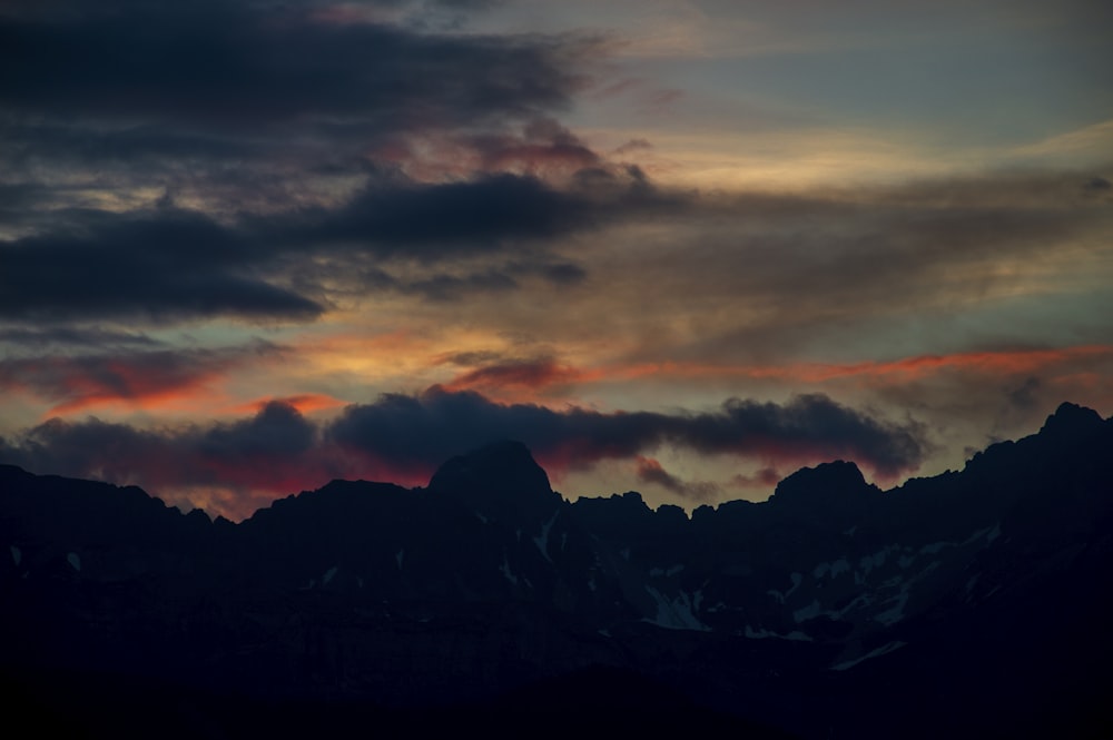 grey clouds and orange sunset