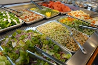 A vibrant salad bar with fresh, colorful ingredients displayed.