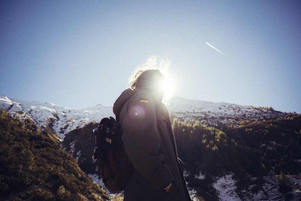 person standing on mountain