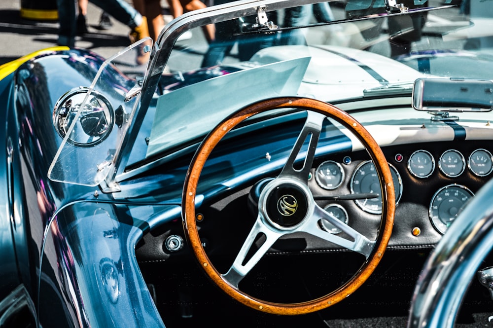 blue vehicle with brown steering wheel