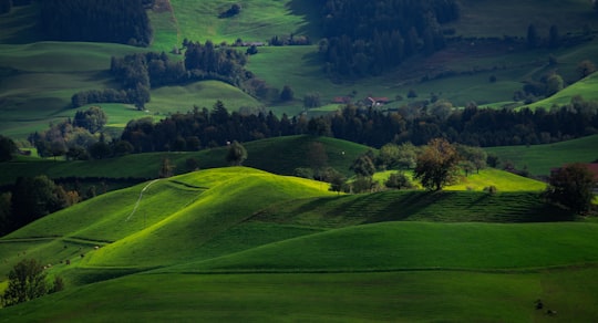 landscape photo of mountains during daytime in Hirzel Switzerland