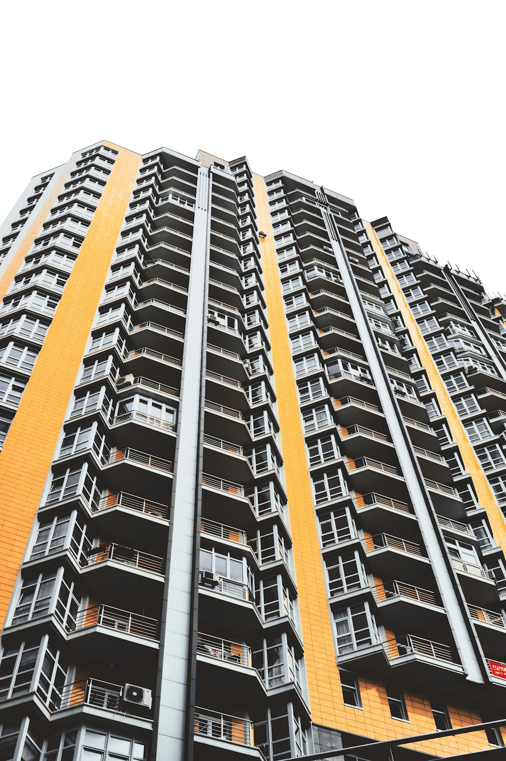 gray and orange concrete high-rise building