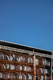 Shelves filled with organized used auto parts in a clean, well-lit store environment.