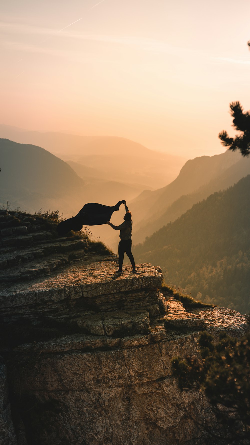 person holding cloth on top of rock