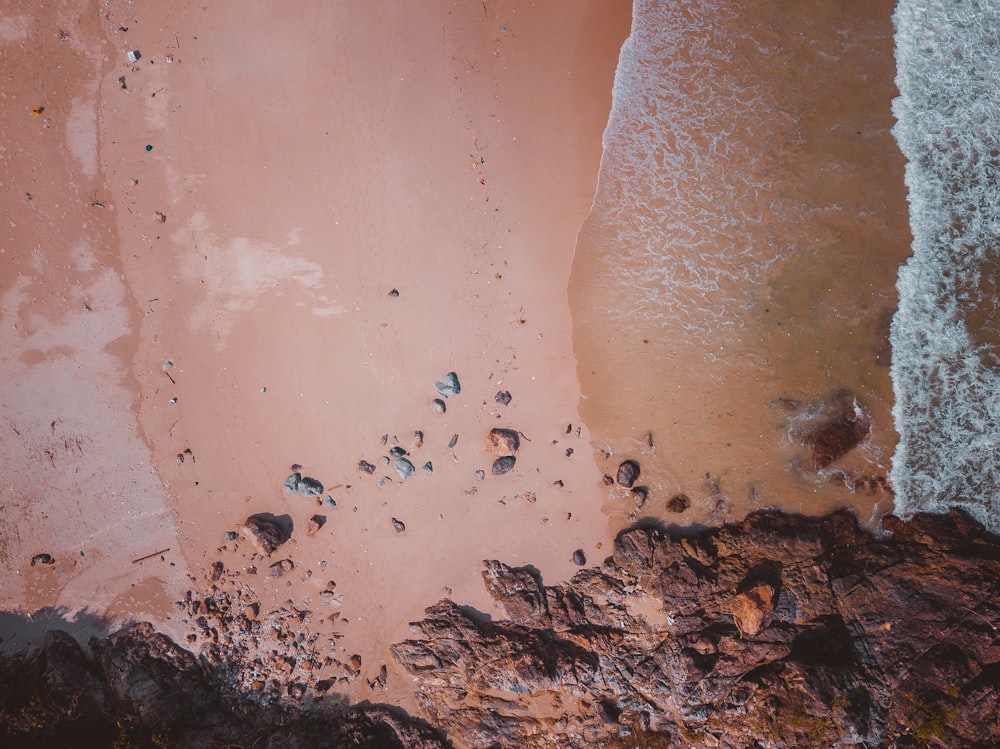 an aerial view of a sandy beach and ocean