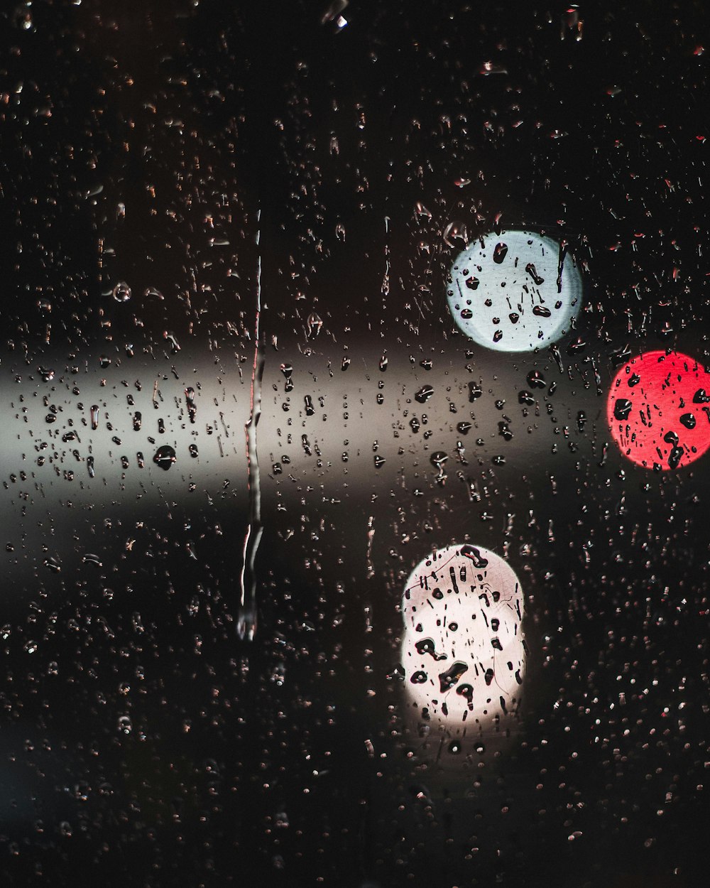 water dew on glass with bokeh lights