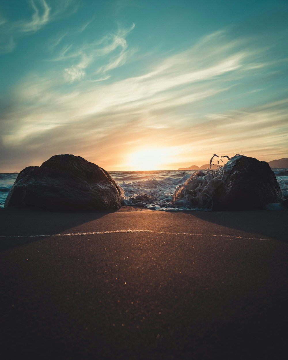 two rocks in seashore