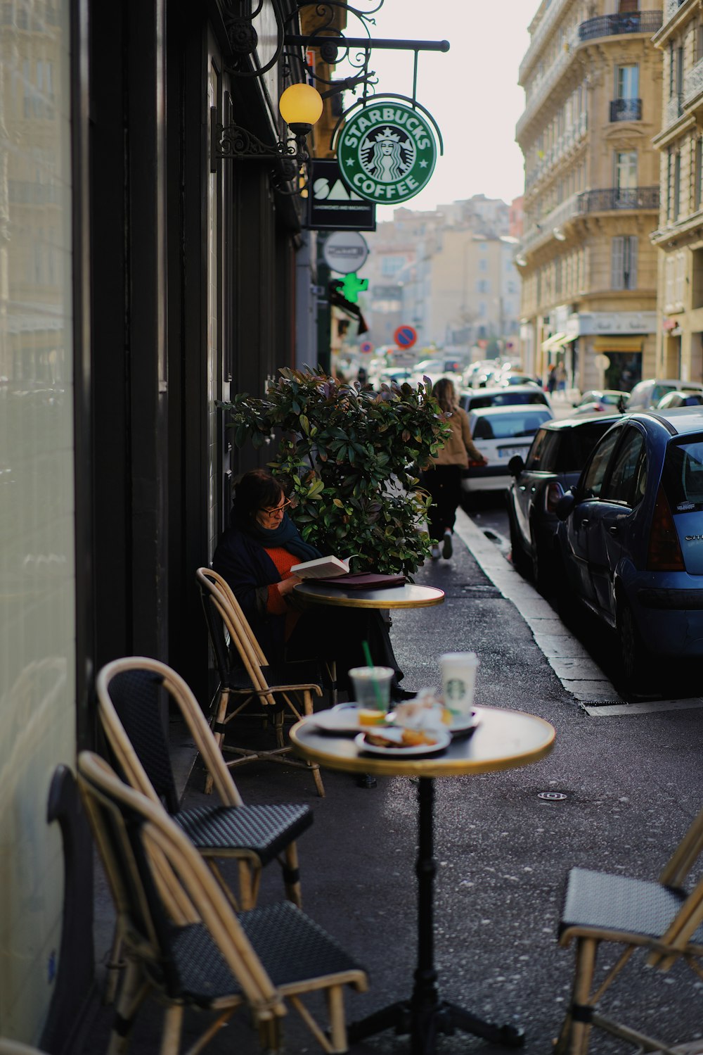 white-and-black bistro set of 3 beside building