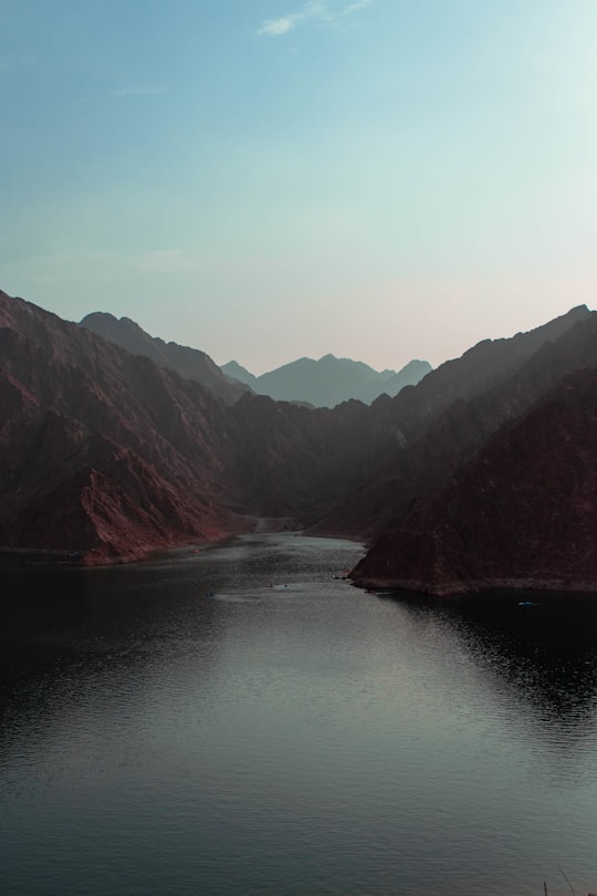 lake near mountain at daytime in Hatta United Arab Emirates