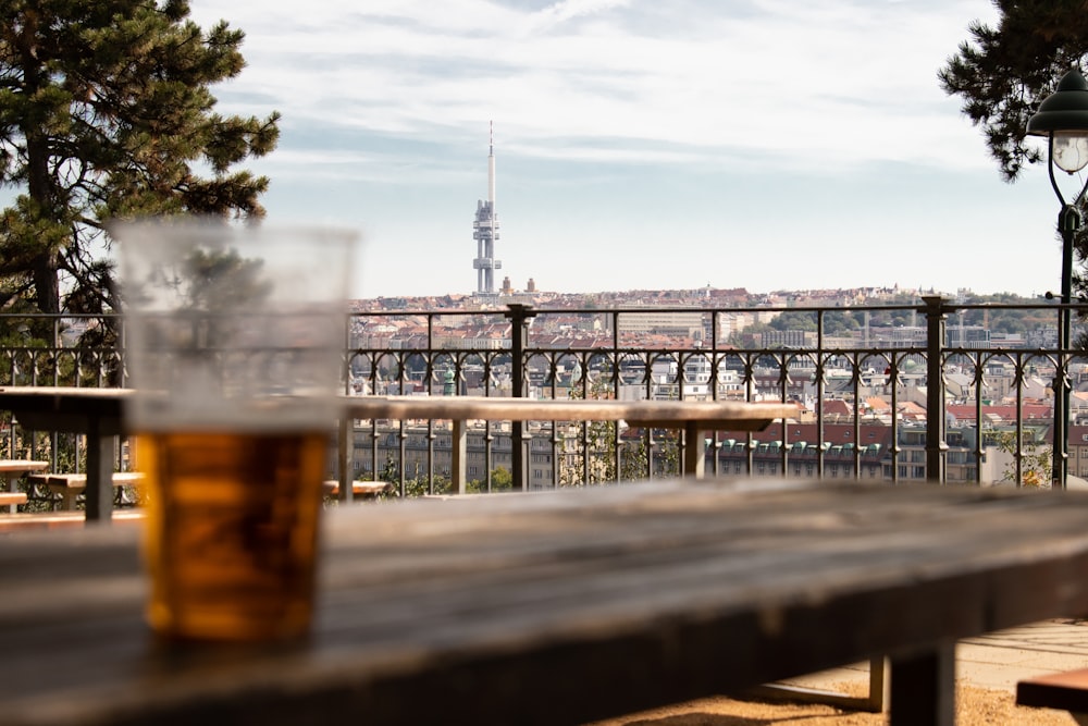 brown filled clear drinking glass on table