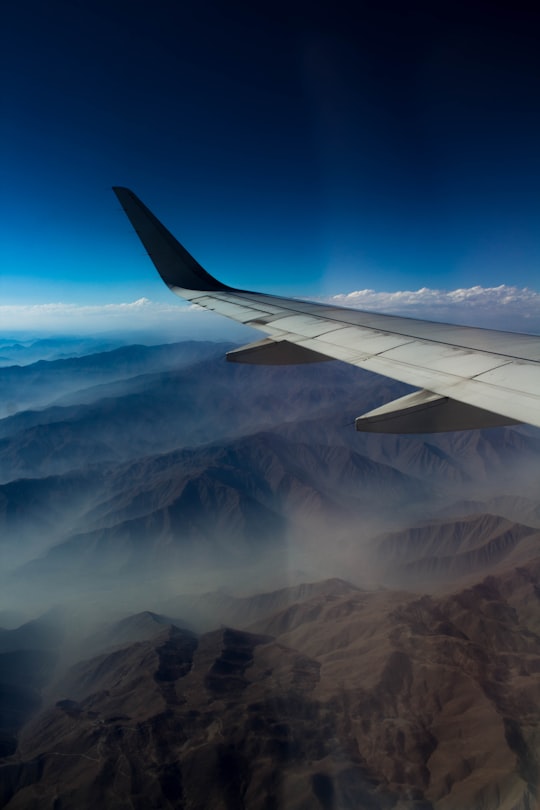 airplane window view photography of mountains in Cusco Peru