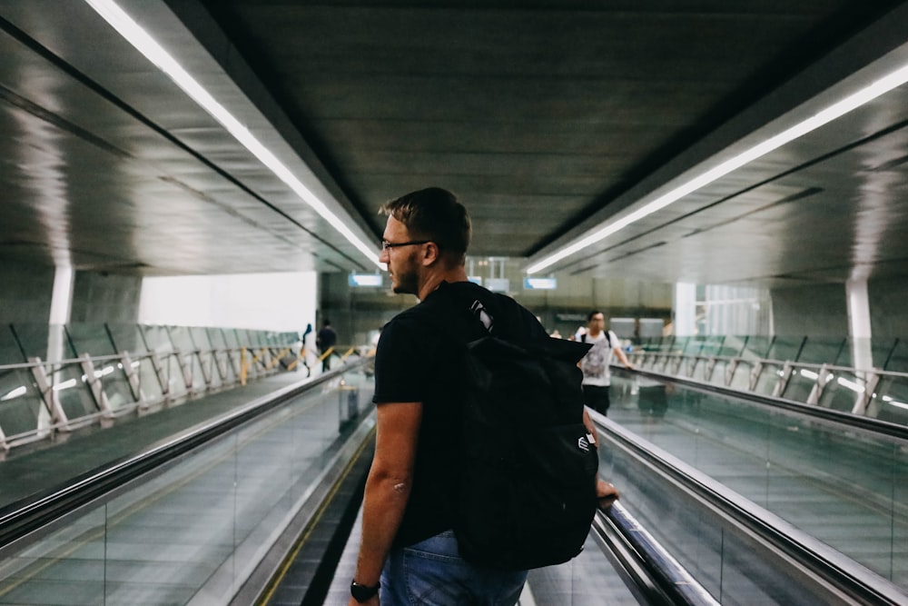 man wearing black backpack