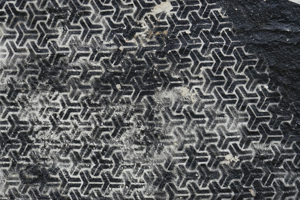 a black and white rug with a pattern on it