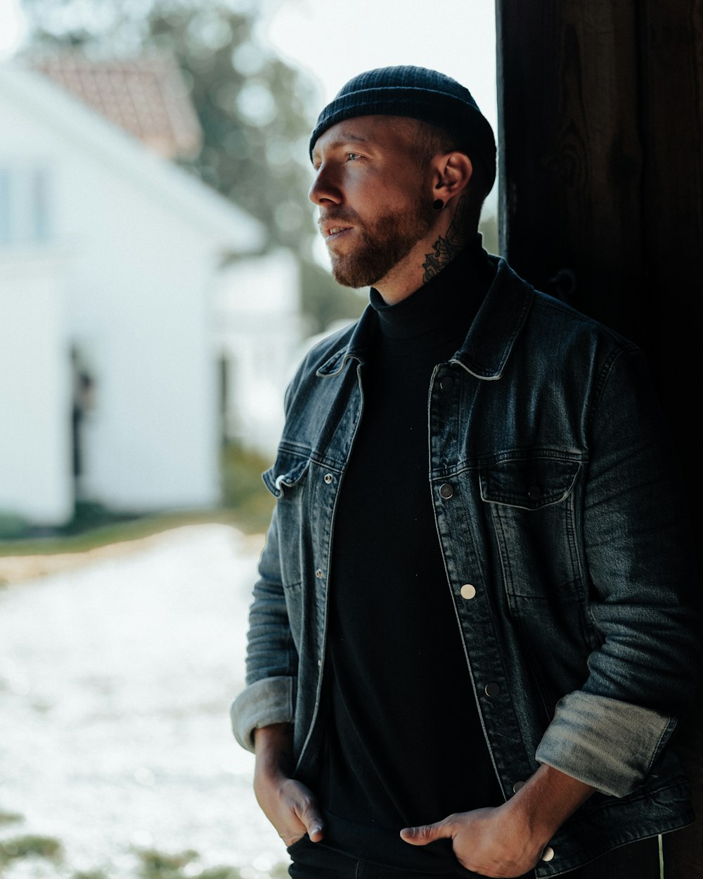 man leaning on wall