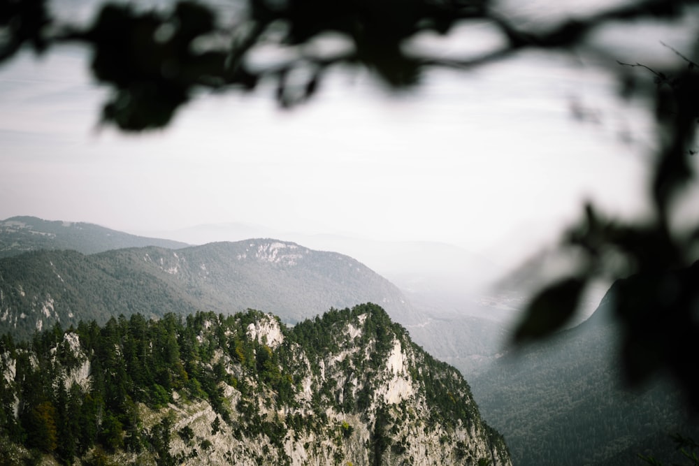 high angle photography of misty mountain terrain