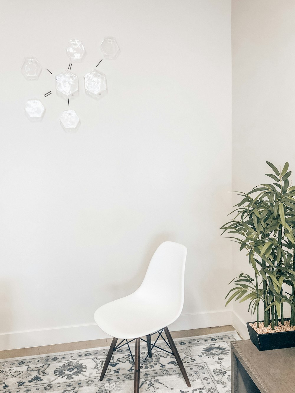 white and brown metal chair beside table