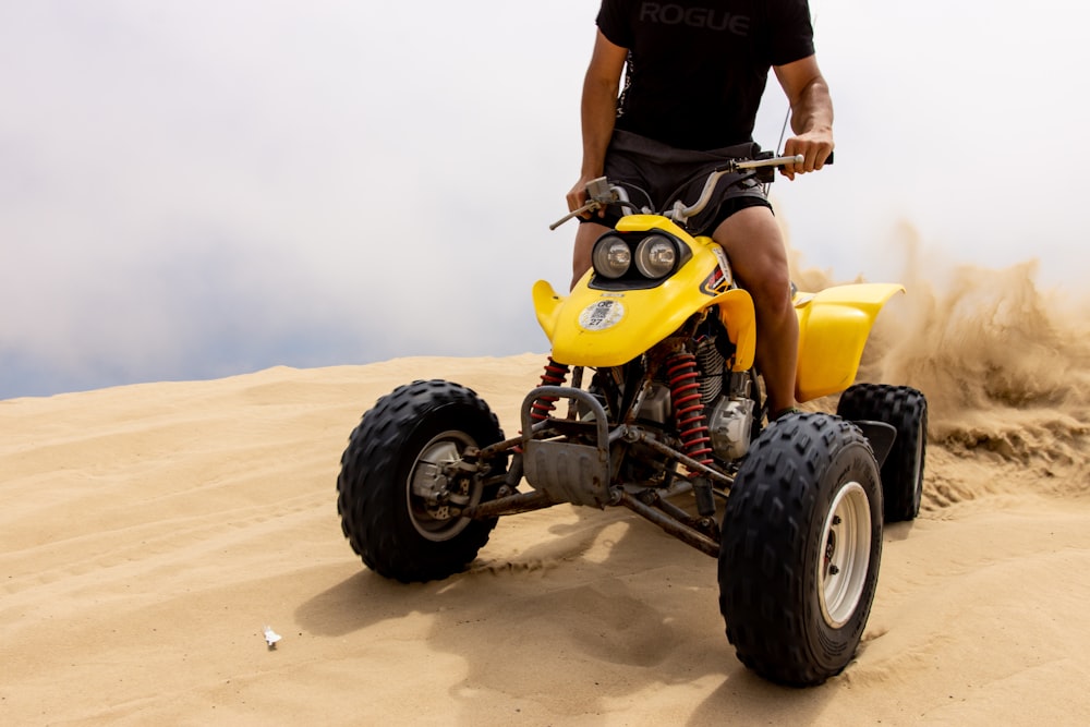 person riding ATV on desert