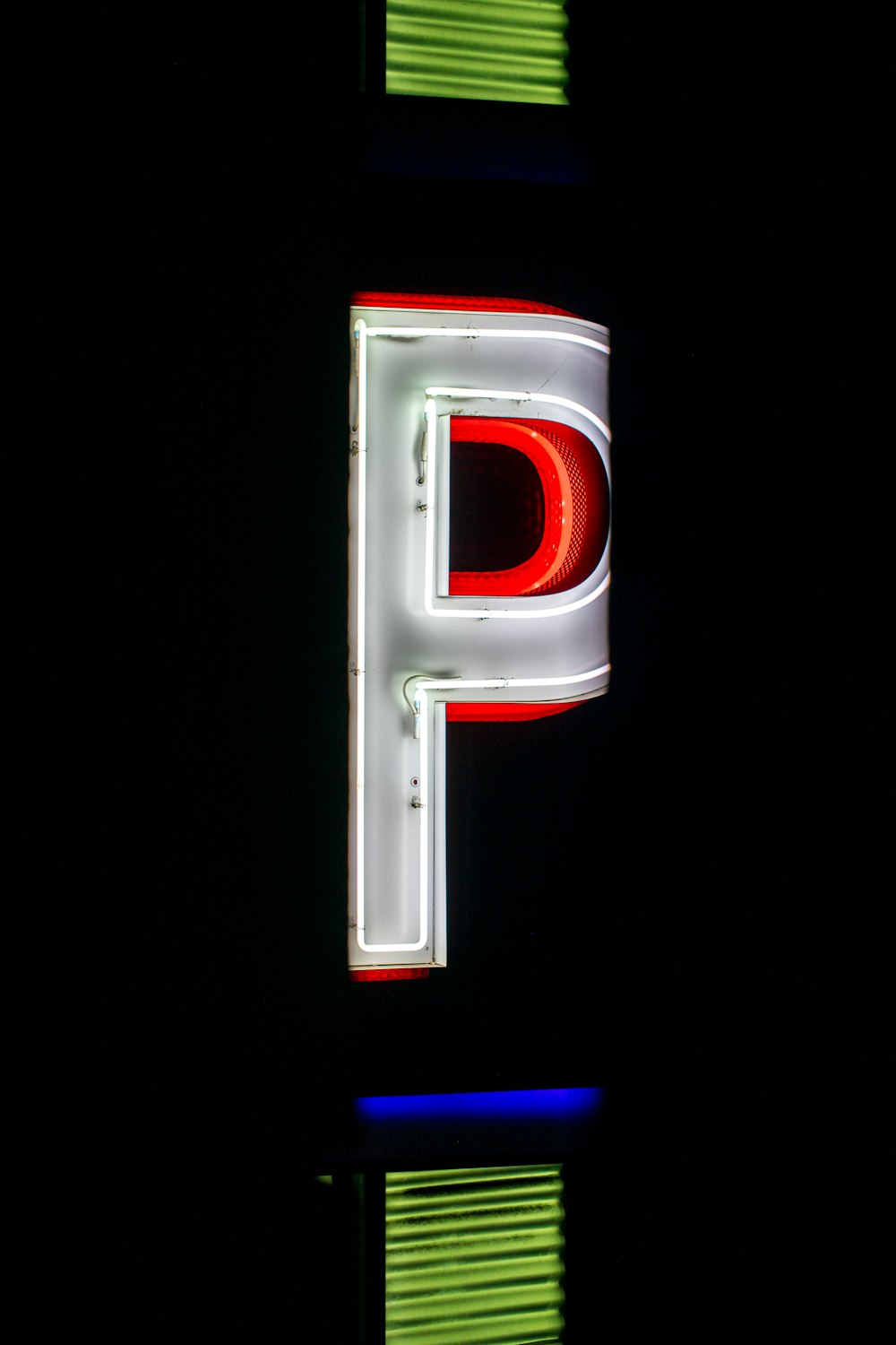 a neon sign that is lit up in the dark