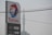 A tall sign for Total with the company's logo and current petrol and diesel prices. The backdrop includes an overcast sky and visible power lines overhead.