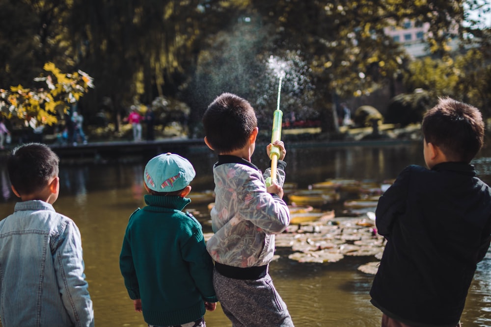 boy playing near the river