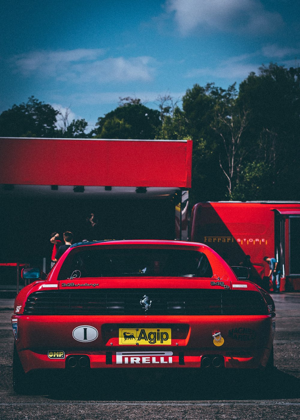 red vehicle on focus photography