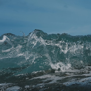 A detailed 3D simulation of ocean waves interacting with a ship hull.