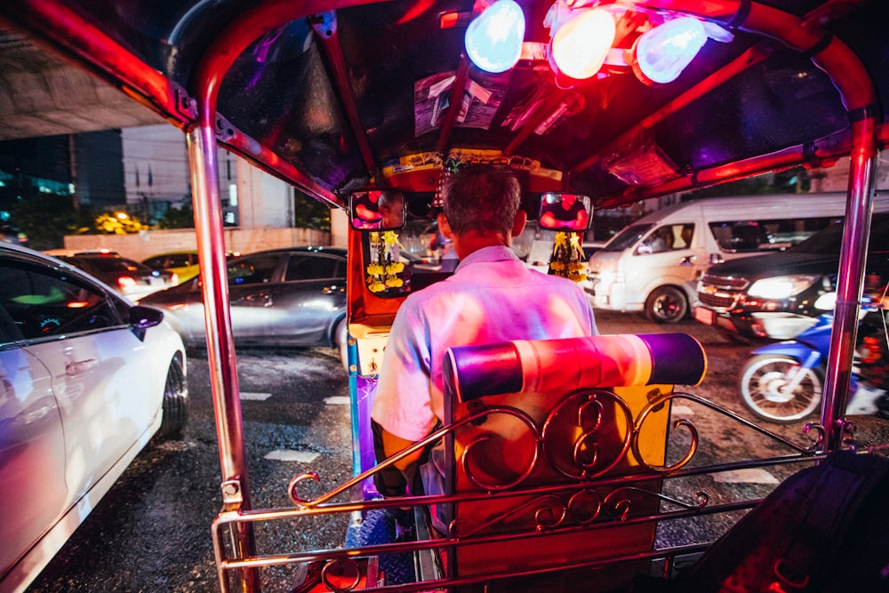 person driving auto-rickshaw
