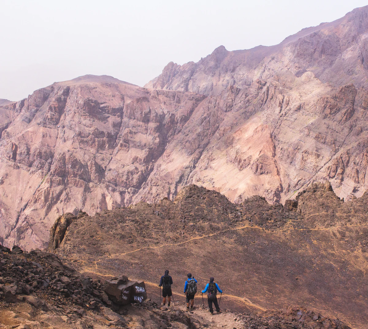 Trekkers resting near a High Atlas summit, Morocco
